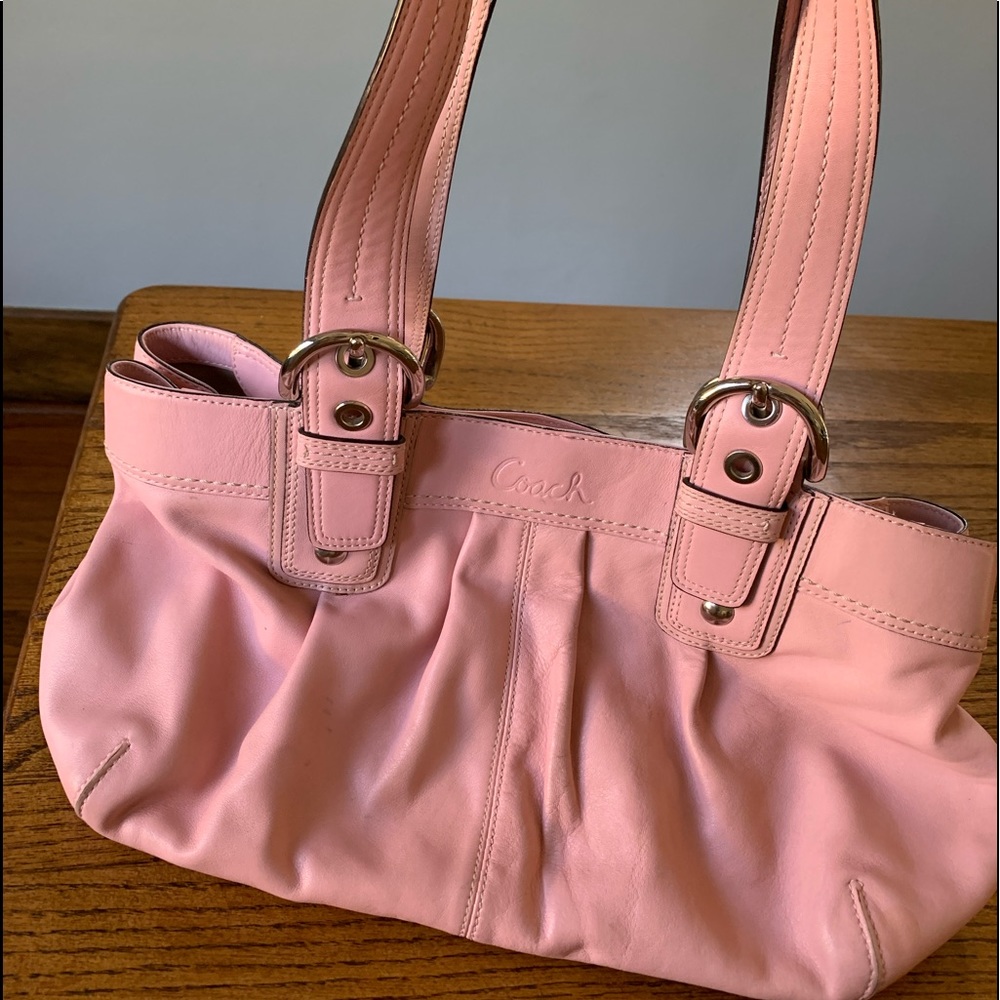 Unique and adorable pale pink leather Coach purse.